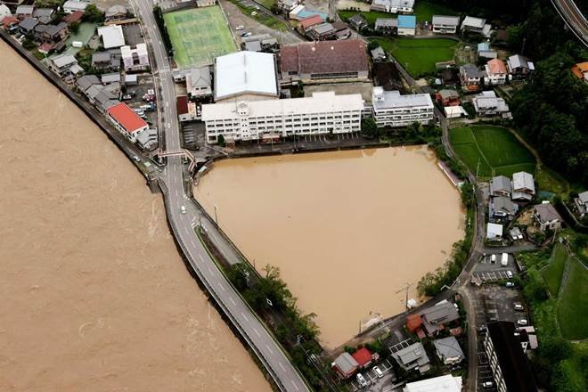 Japan battered by more heavy rain, floods, nearly 60 dead